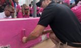 Johnson paints the wall pink for breast cancer awareness