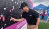 Johnson paints the wall pink for breast cancer awareness