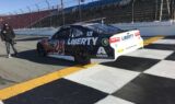 Byron displays 2018 Liberty University firesuit and Chevy