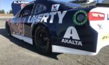 Byron displays 2018 Liberty University firesuit and Chevy