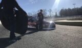 Byron displays 2018 Liberty University firesuit and Chevy