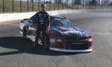 Byron displays 2018 Liberty University firesuit and Chevy