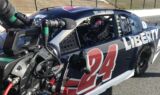 Byron displays 2018 Liberty University firesuit and Chevy